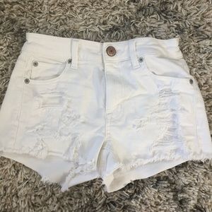 White, ripped jean shorts